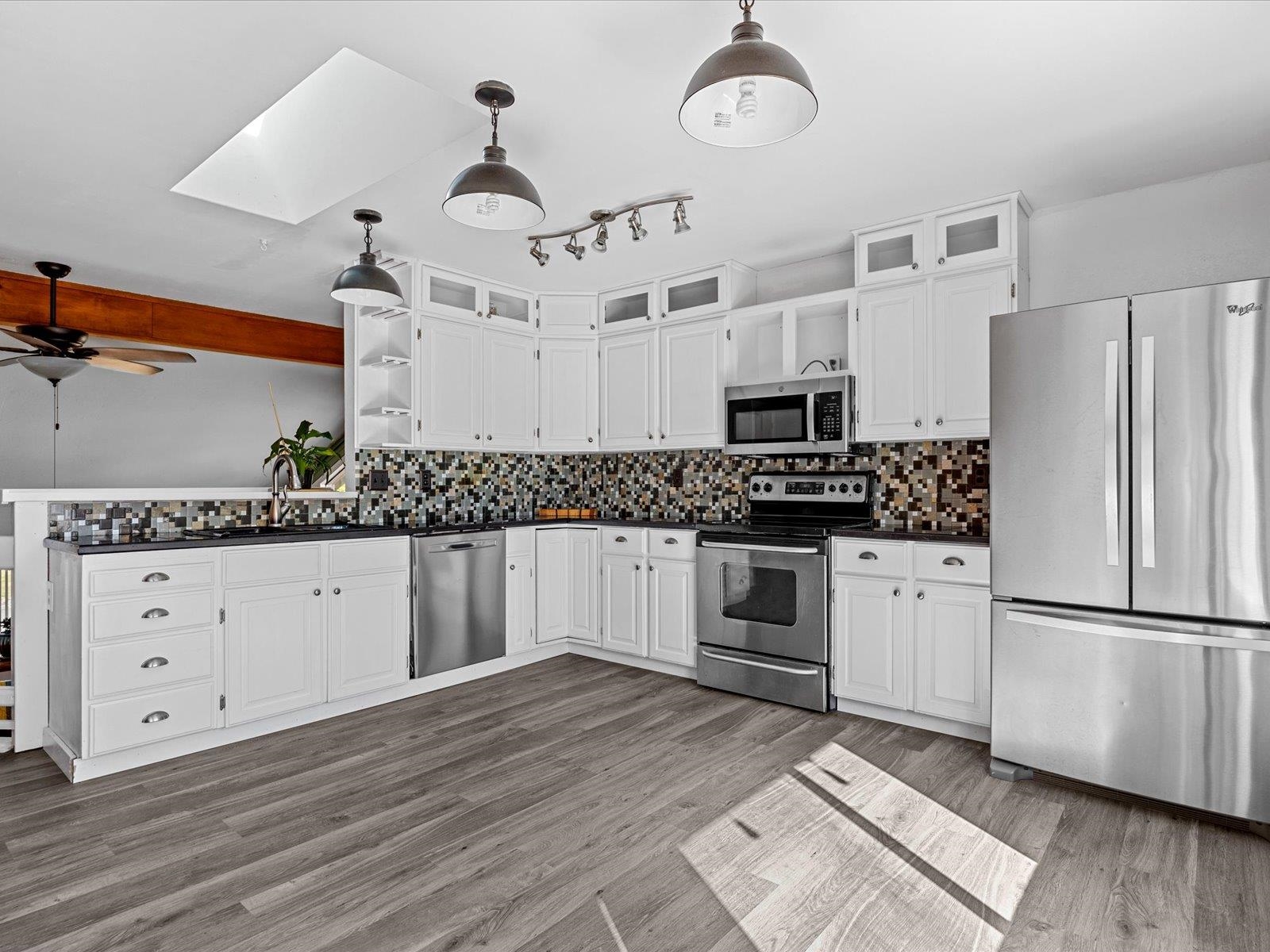 2369 1/2 Rana Road Grand Junction, CO 81507 - Photo 7 of 33 The spacious kitchen has glass tile backsplash & g