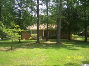 1305 Old Pageland Monroe Road Wingate, NC 28174 - Photo 1 of 5 a swimming pool with outdoor seating and yard
