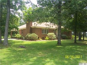 1305 Old Pageland Monroe Road Wingate, NC 28174 - Photo 3 of 5 a front view of a house with garden