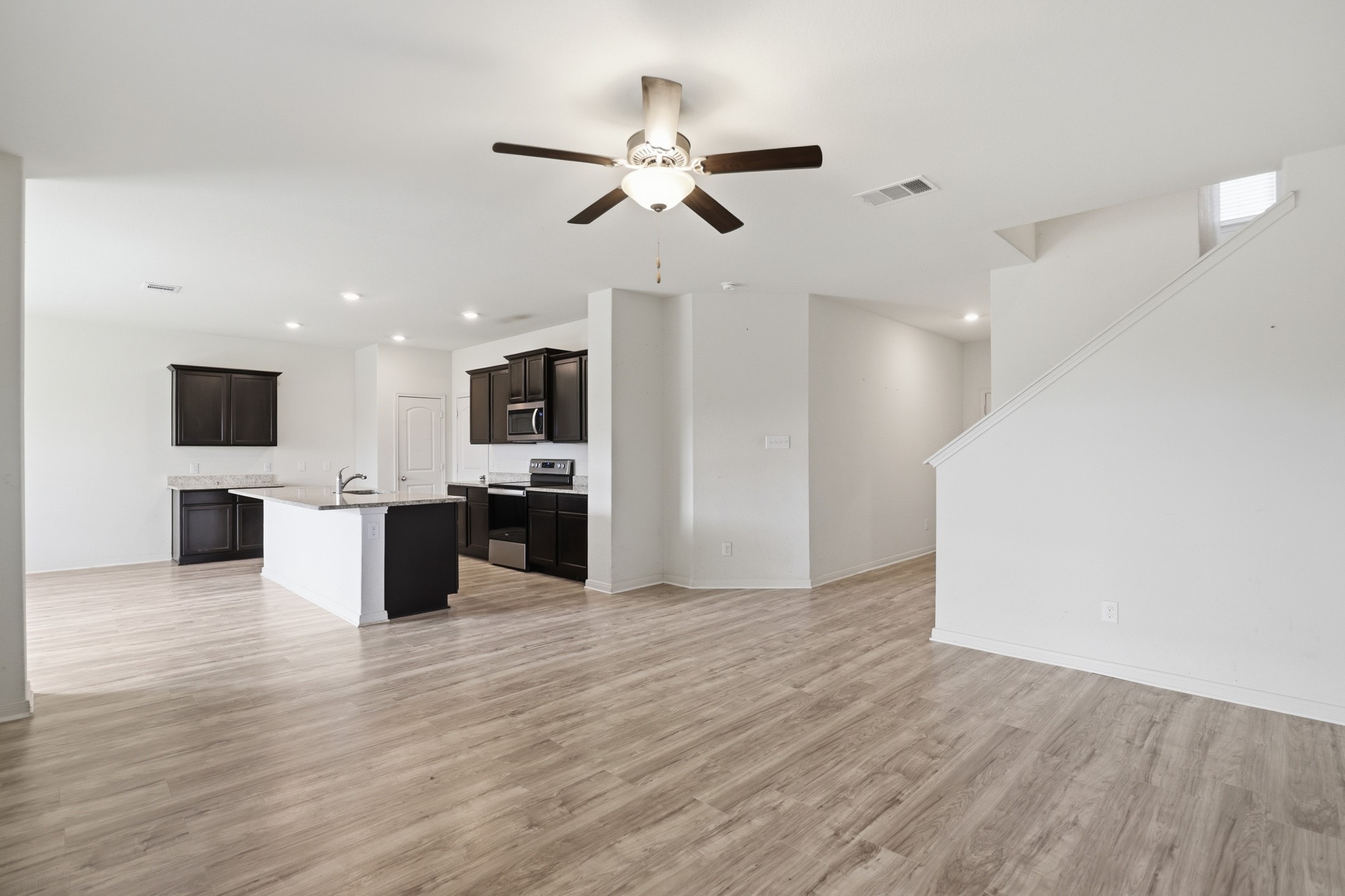 300 Hyacinth Way Jarrell, TX 76537 - Photo 9 of 37 a view of kitchen with microwave and refrigerator