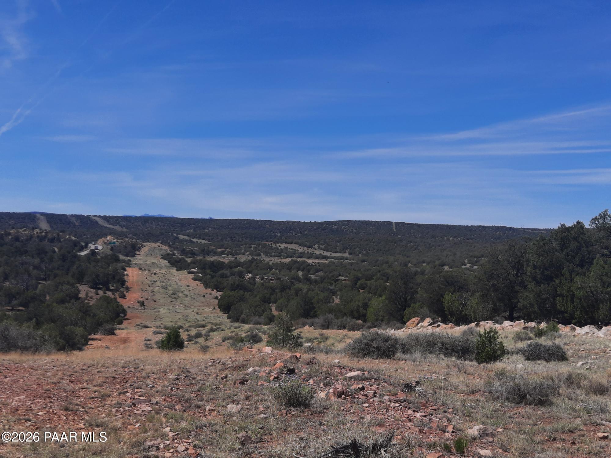 3 V Fort Rock Road Seligman, AZ 86337 - Photo 11 of 13 a view of a dry yard with mountains in the background