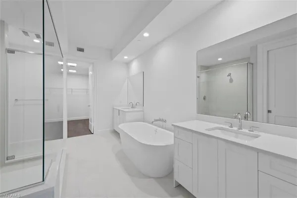 a hall with a sink and a large window