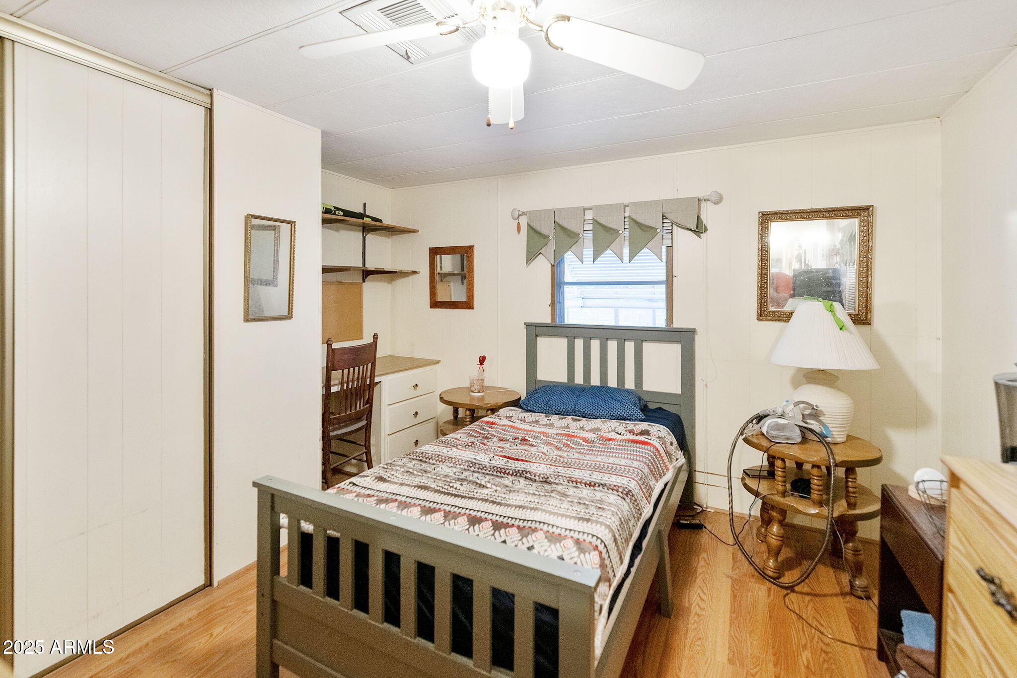 11100 East Apache Trail Apache Junction, AZ 85120 - Photo 11 of 22 a bedroom with a bed and a table in it