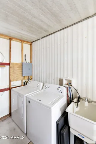 a view of a kitchen with a table and chairs