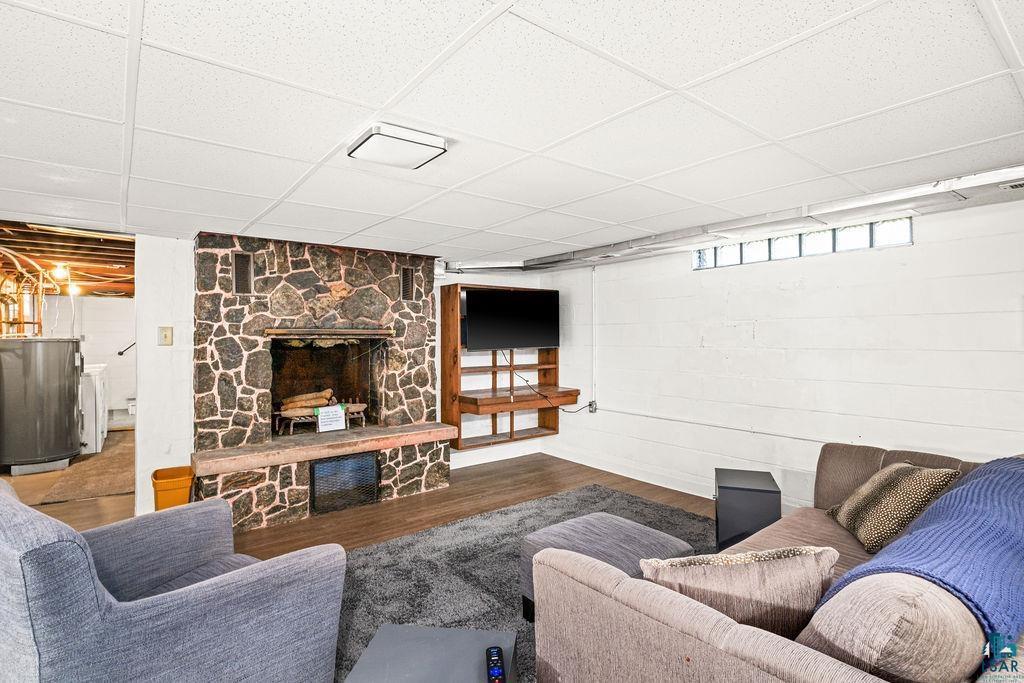 4543 County Road East South Range, WI 54874 - Photo 21 of 43 Stone-clad fireplace with a hearth and wood-finish flooring