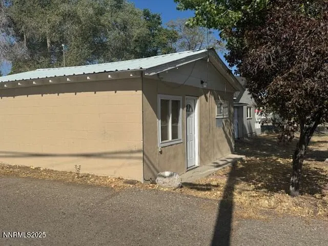 a view of a house with a snow on the road