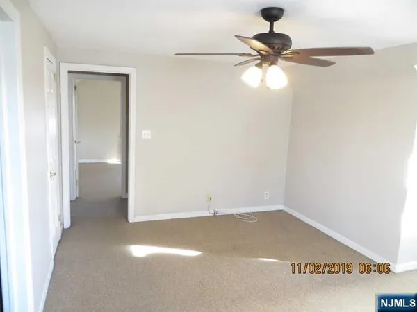 a view of a small space with a fan
