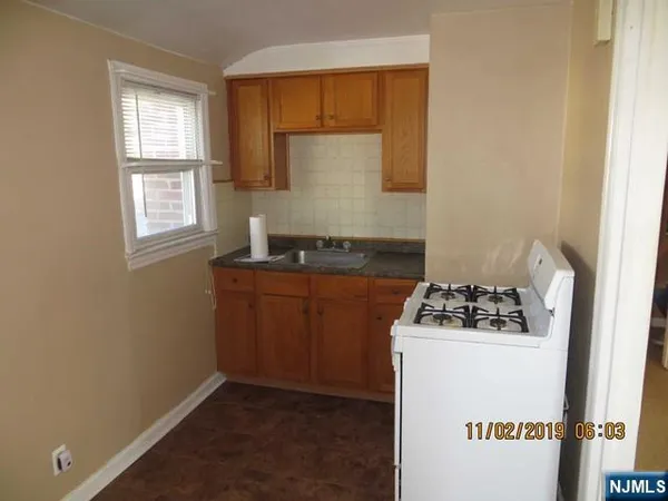a kitchen with a stove and cabinets