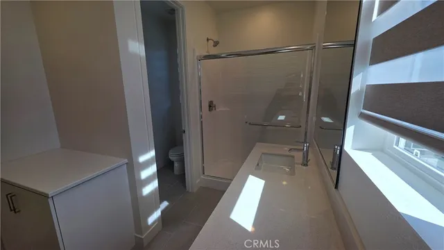 a bathroom with a double vanity sink and mirror