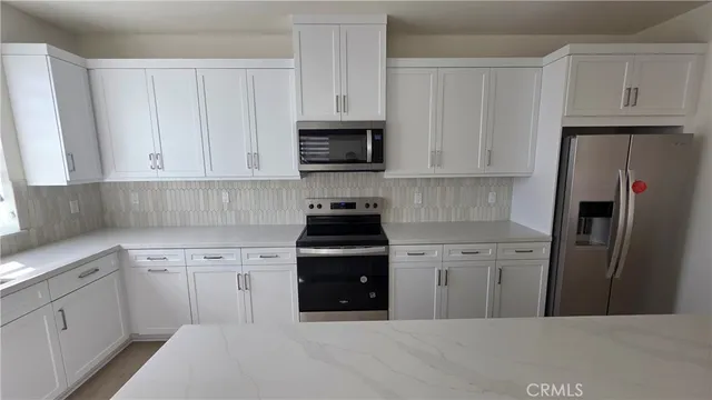 a view of cabinets and wooden floor