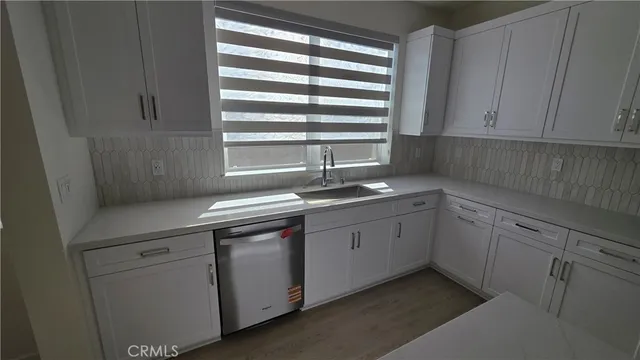 a view of workspace with furniture and wooden floor