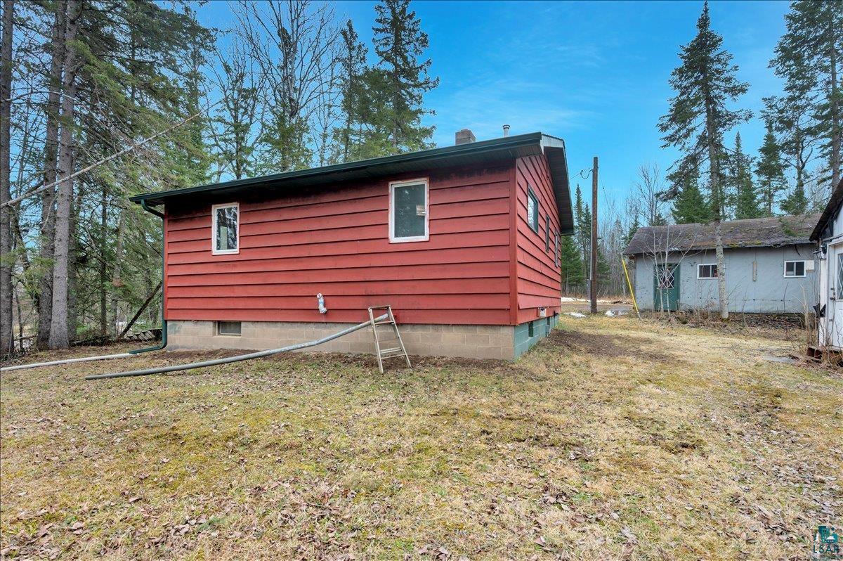 6355 Stoney Brook Road Alborn, MN 55702 - Photo 12 of 18 View of home's exterior with a yard and a chimney