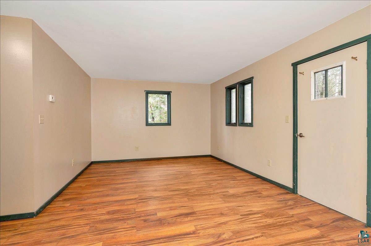 6355 Stoney Brook Road Alborn, MN 55702 - Photo 2 of 18 Spare room featuring light wood-style flooring