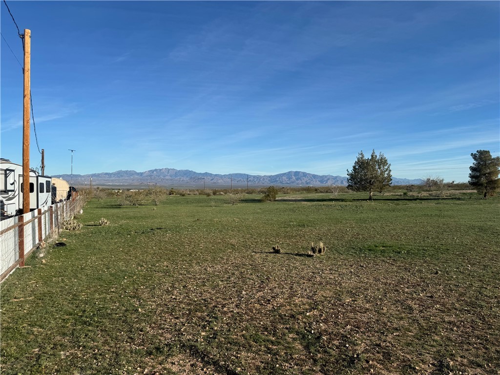 2980 Naco Road Golden Valley, AZ 86413 - Photo 3 of 3 View of yard with a view of countryside and a mountain view