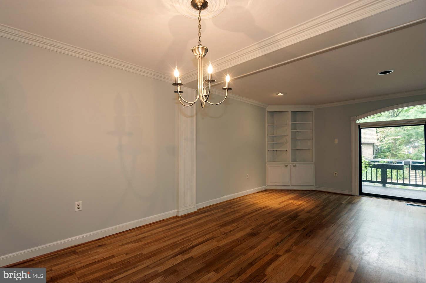 7964 Inverness Ridge Road Potomac, MD 20854 - Photo 17 of 28 a view of a livingroom with wooden floor and a ceiling fan