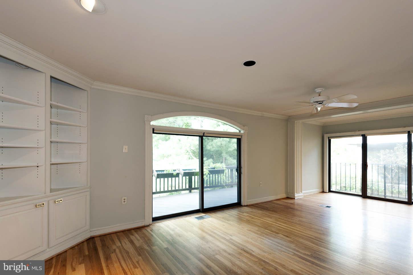 7964 Inverness Ridge Road Potomac, MD 20854 - Photo 19 of 28 wooden floor in an empty room with a window