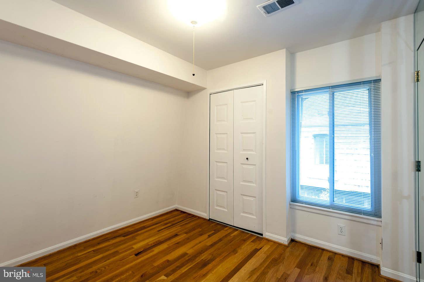 7964 Inverness Ridge Road Potomac, MD 20854 - Photo 23 of 28 a view of empty room with wooden floor and fan