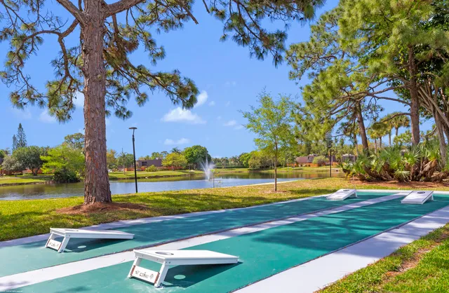 a view of a swimming pool with an outdoor space and seating area