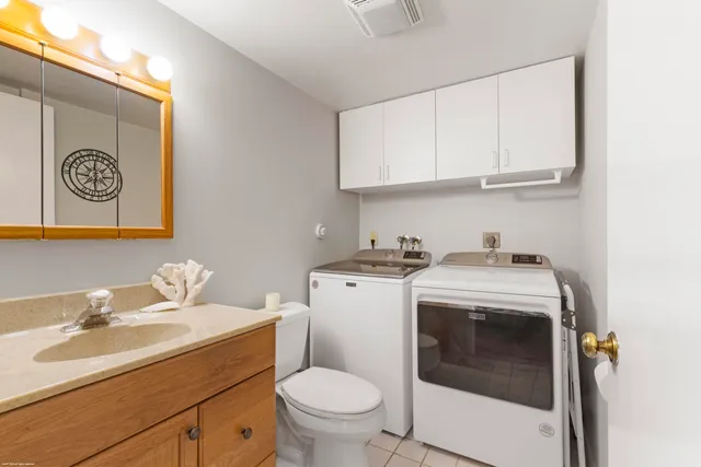 a view of bathroom with a sink and a washer