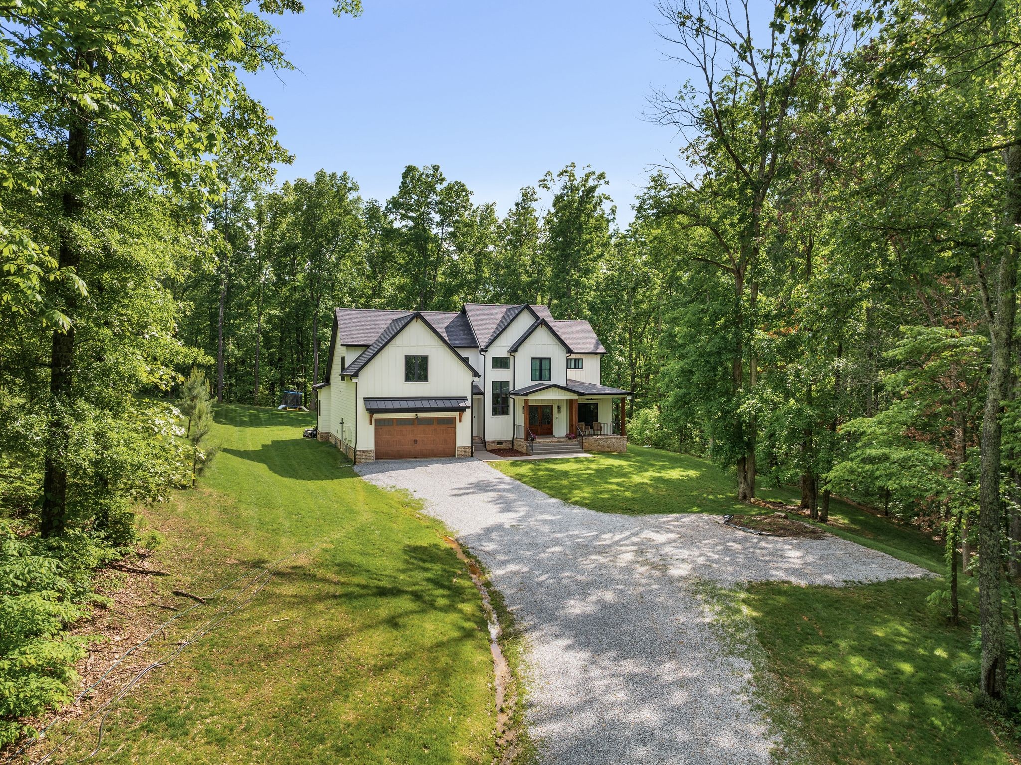 7361 Liberty Road Fairview, TN 37062 - Photo 1 of 71 a front view of a house with yard and green space