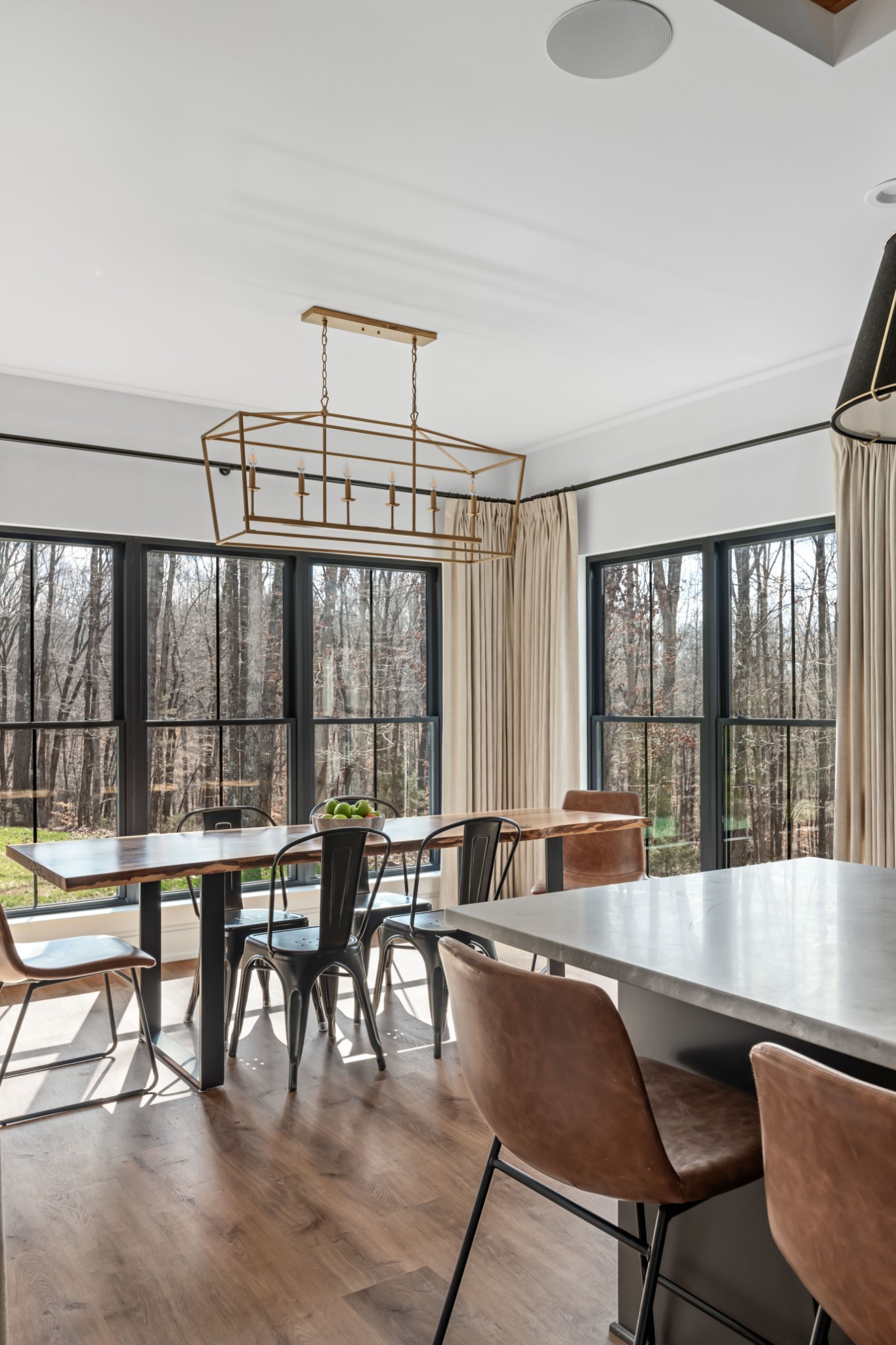 7361 Liberty Road Fairview, TN 37062 - Photo 17 of 71 a view of a dining room with furniture large windows and wooden floor