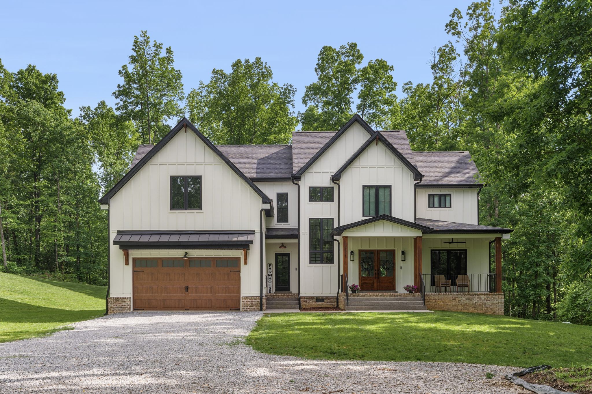 7361 Liberty Road Fairview, TN 37062 - Photo 2 of 71 a front view of a house with a yard and garage