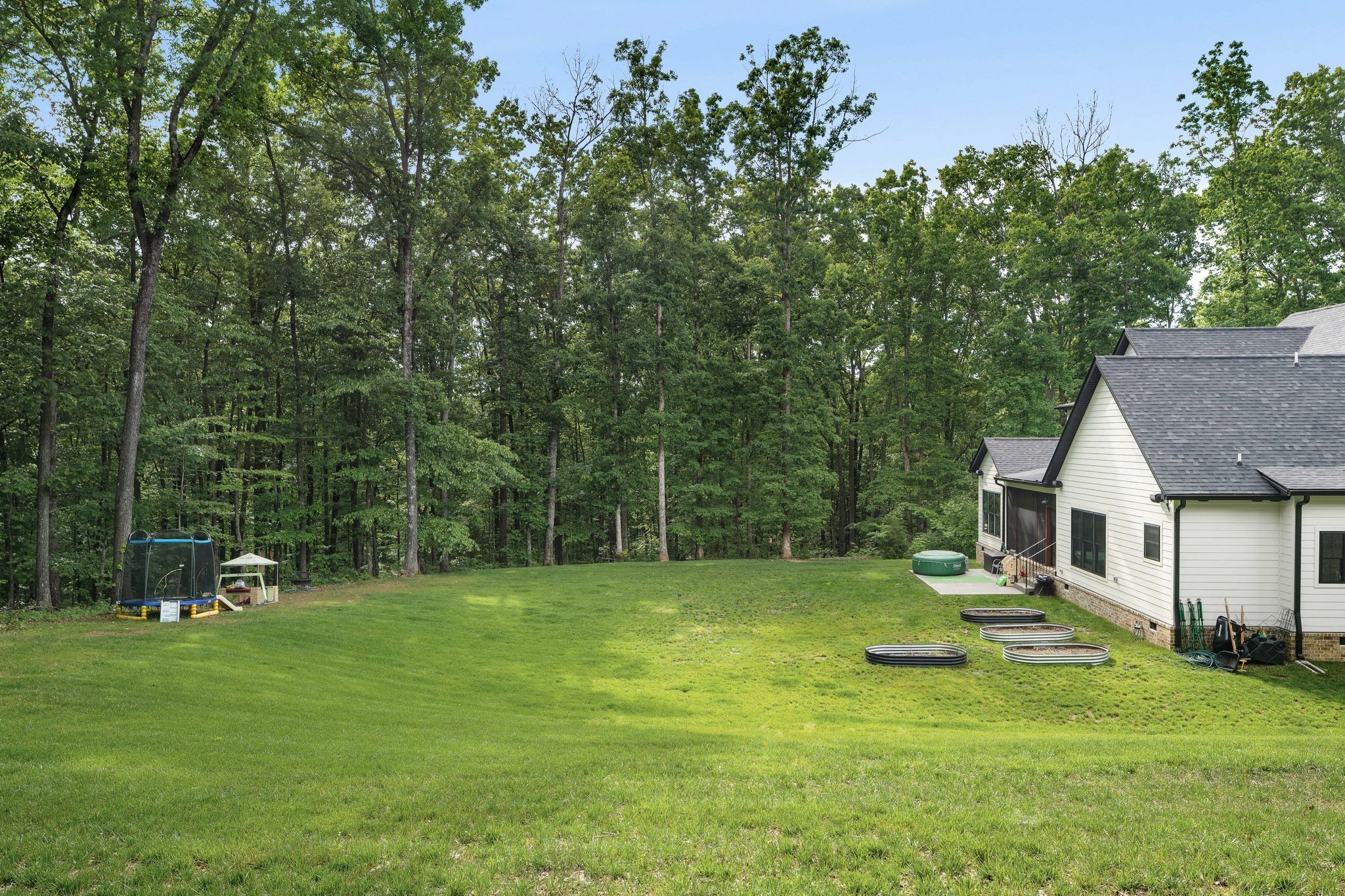 7361 Liberty Road Fairview, TN 37062 - Photo 53 of 71 a view of a house with a backyard and a tree