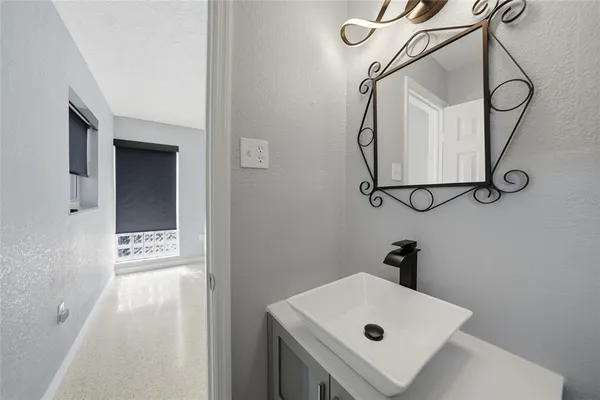 a bathroom with a toilet sink and shower