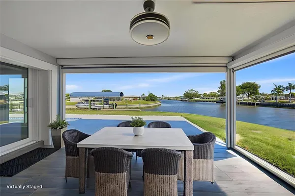 a view of swimming pool with outdoor seating and yard