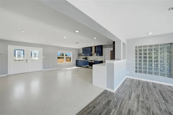 a view of kitchen with furniture and wooden floor