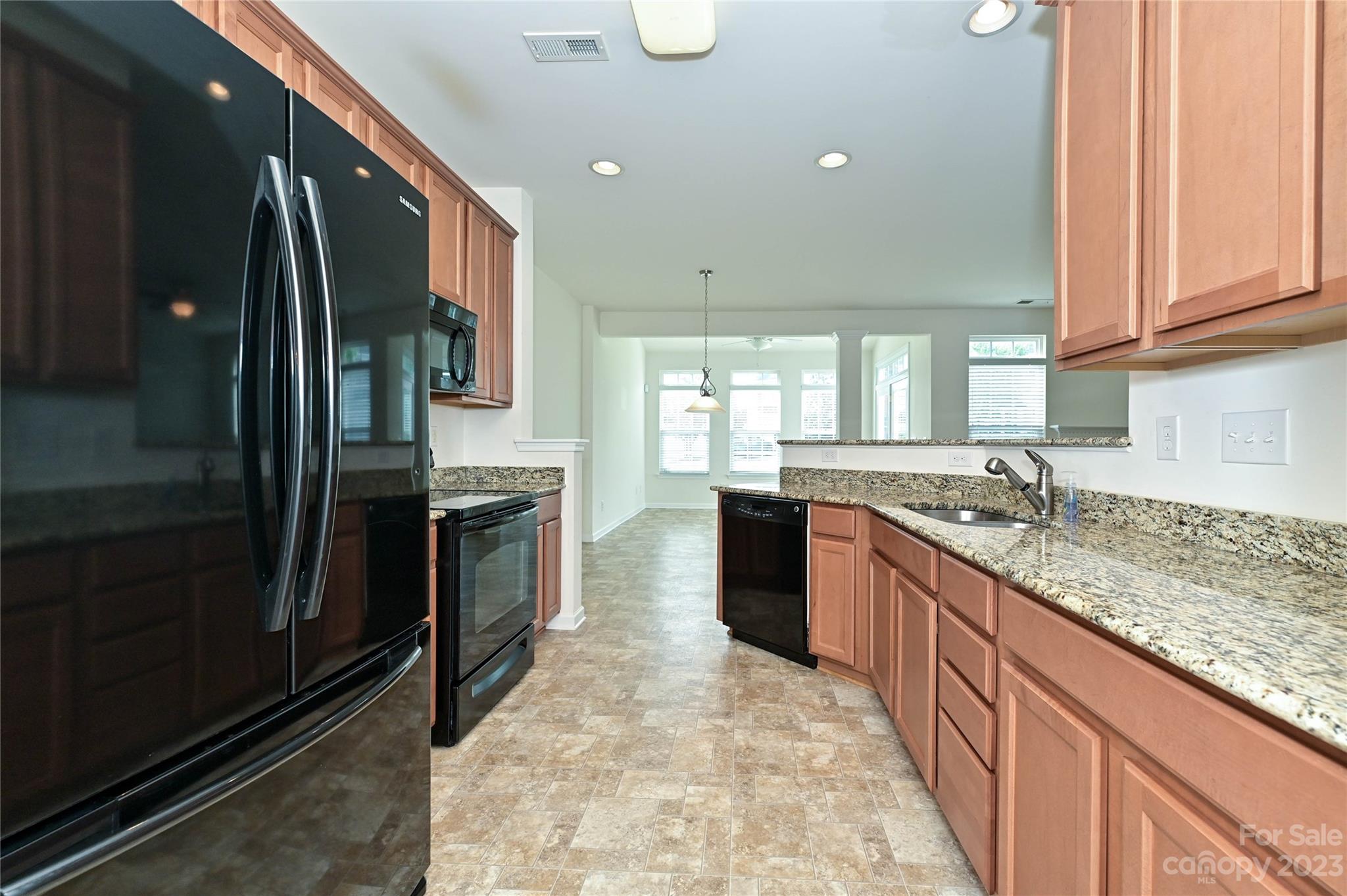 530 White Springs Road, Unit 21 Fort Mill, SC 29708 - Photo 11 of 42 a large kitchen with stainless steel appliances granite countertop a refrigerator and a sink