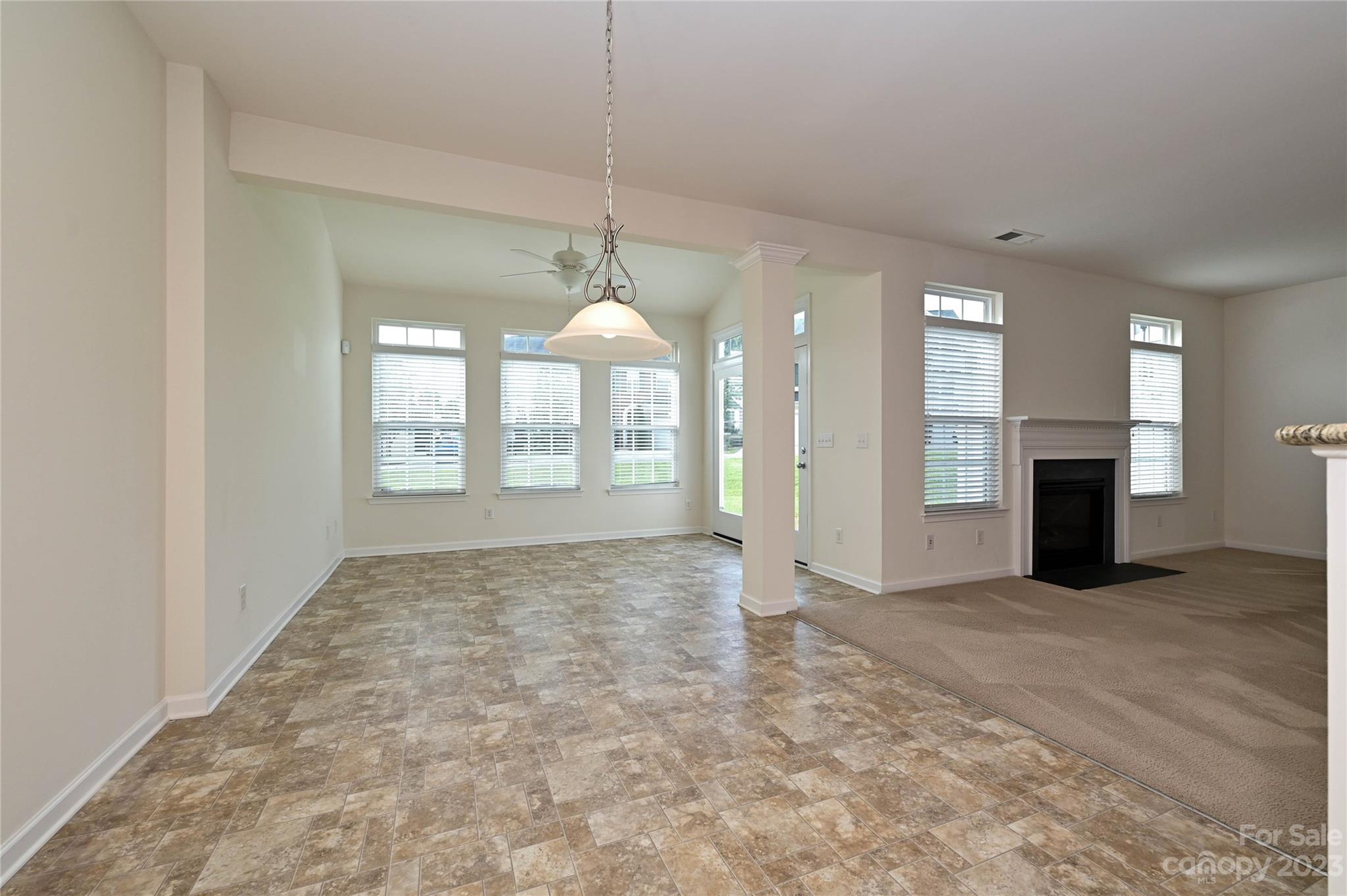 530 White Springs Road, Unit 21 Fort Mill, SC 29708 - Photo 16 of 42 a view of an empty room with a fireplace and a window