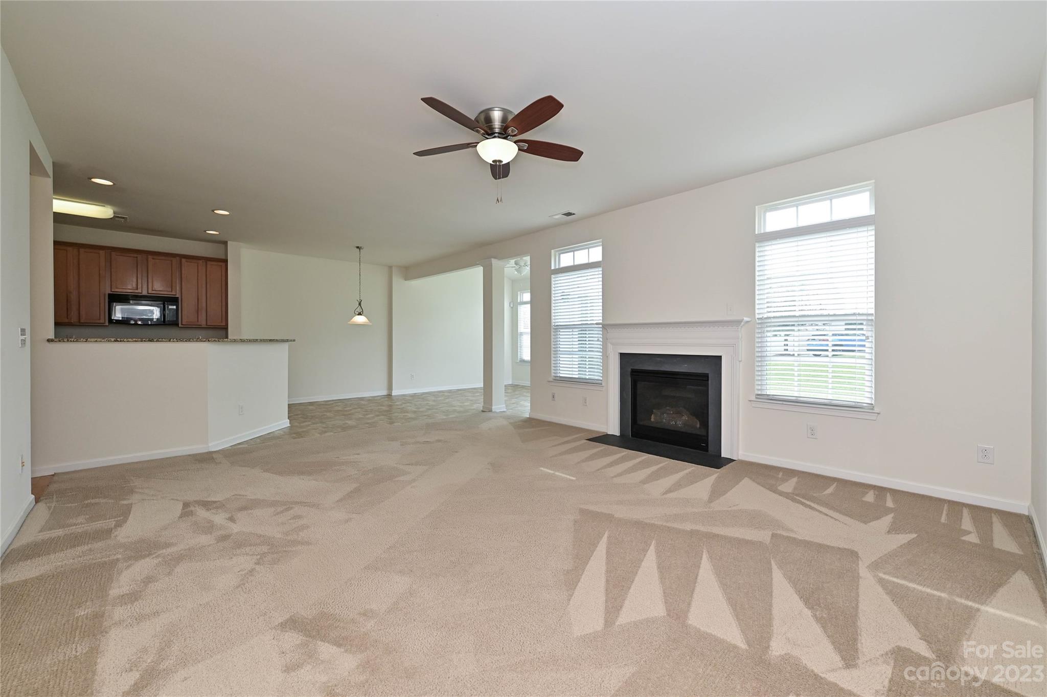 530 White Springs Road, Unit 21 Fort Mill, SC 29708 - Photo 21 of 42 a view of an empty room with a fireplace and a window