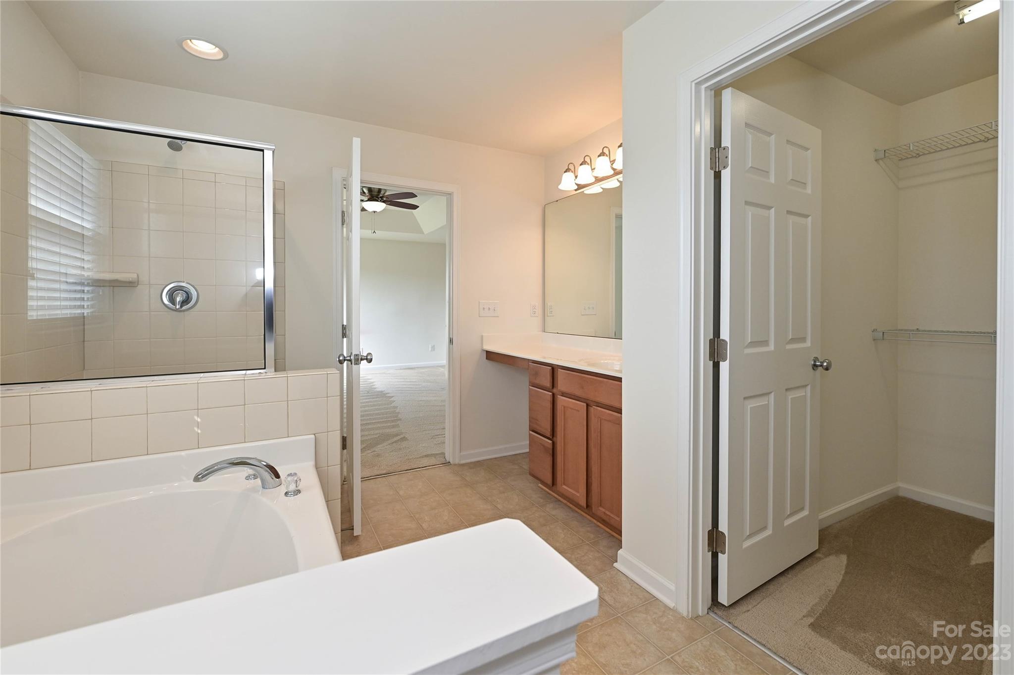 530 White Springs Road, Unit 21 Fort Mill, SC 29708 - Photo 31 of 42 a bathroom with a bathtub a sink and a shower