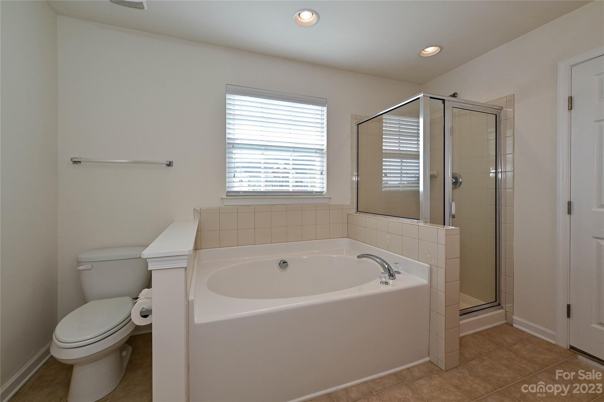 530 White Springs Road, Unit 21 Fort Mill, SC 29708 - Photo 32 of 42 a white bath tub sitting next to a toilet