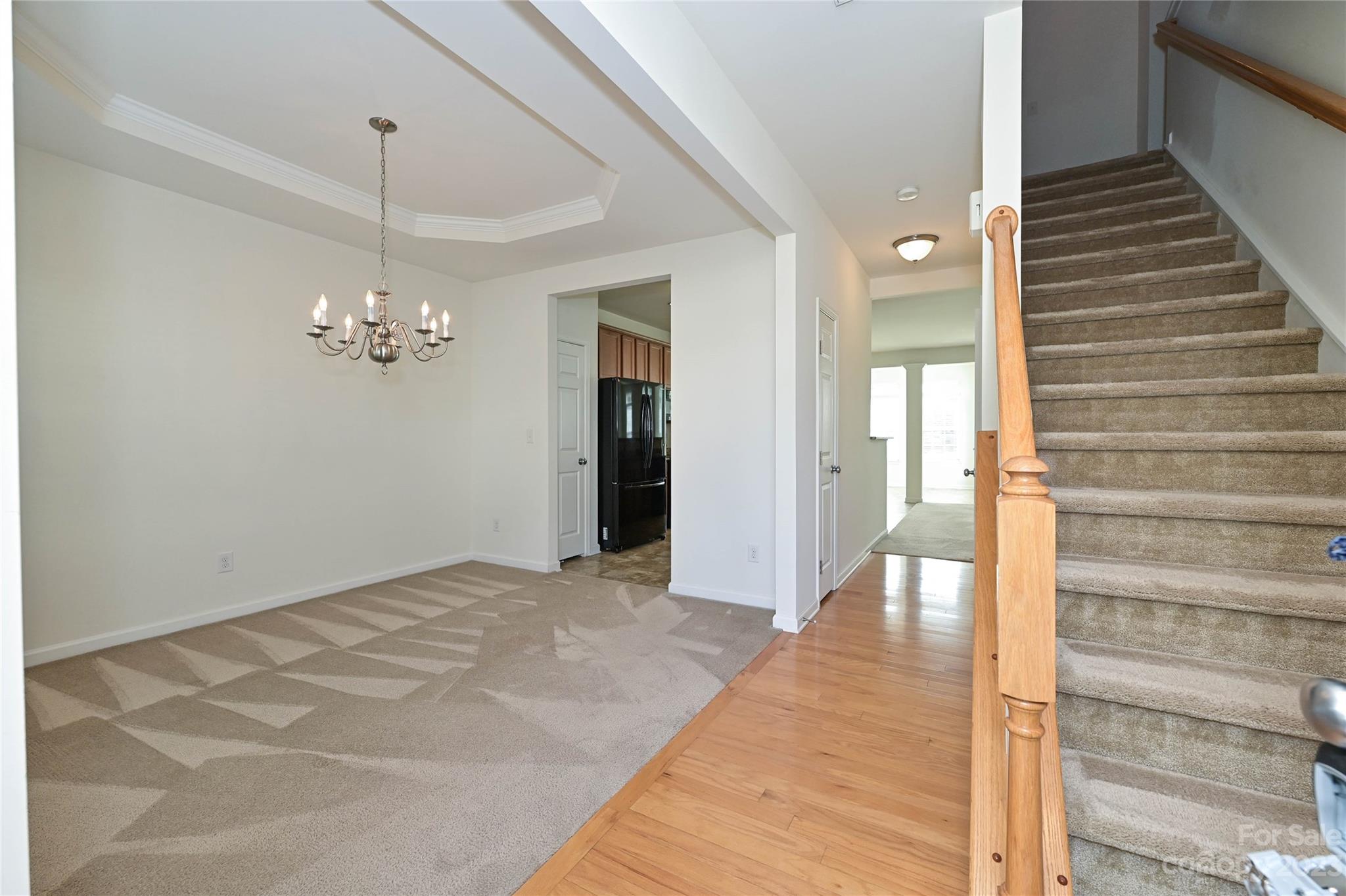 530 White Springs Road, Unit 21 Fort Mill, SC 29708 - Photo 4 of 42 a view of a hallway with wooden floor and staircase
