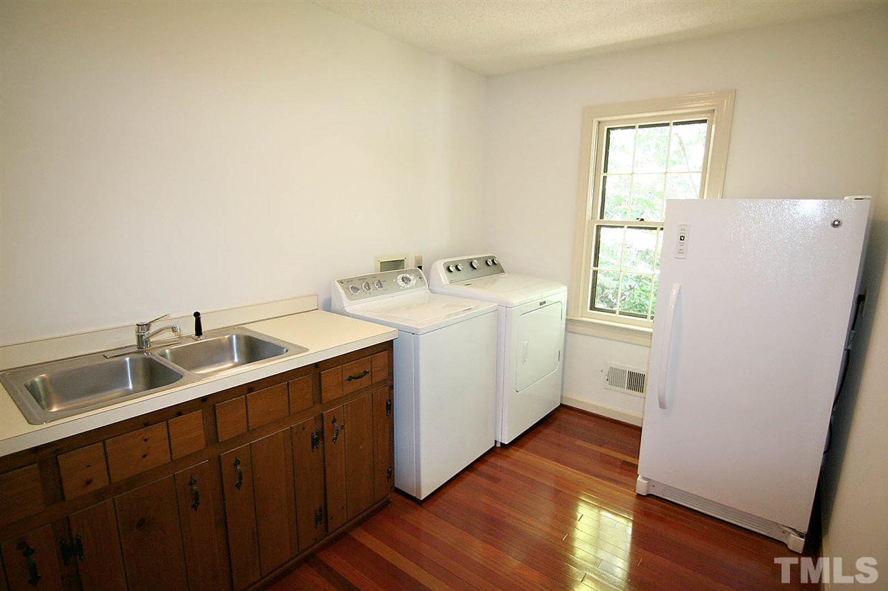 8005 Shellnut Road Raleigh, NC 27615 - Photo 13 of 25 Best Room in the House. Oversized Laundry Room has a Double Utility Sink and offers Plenty of Room for Whatever You need to store.