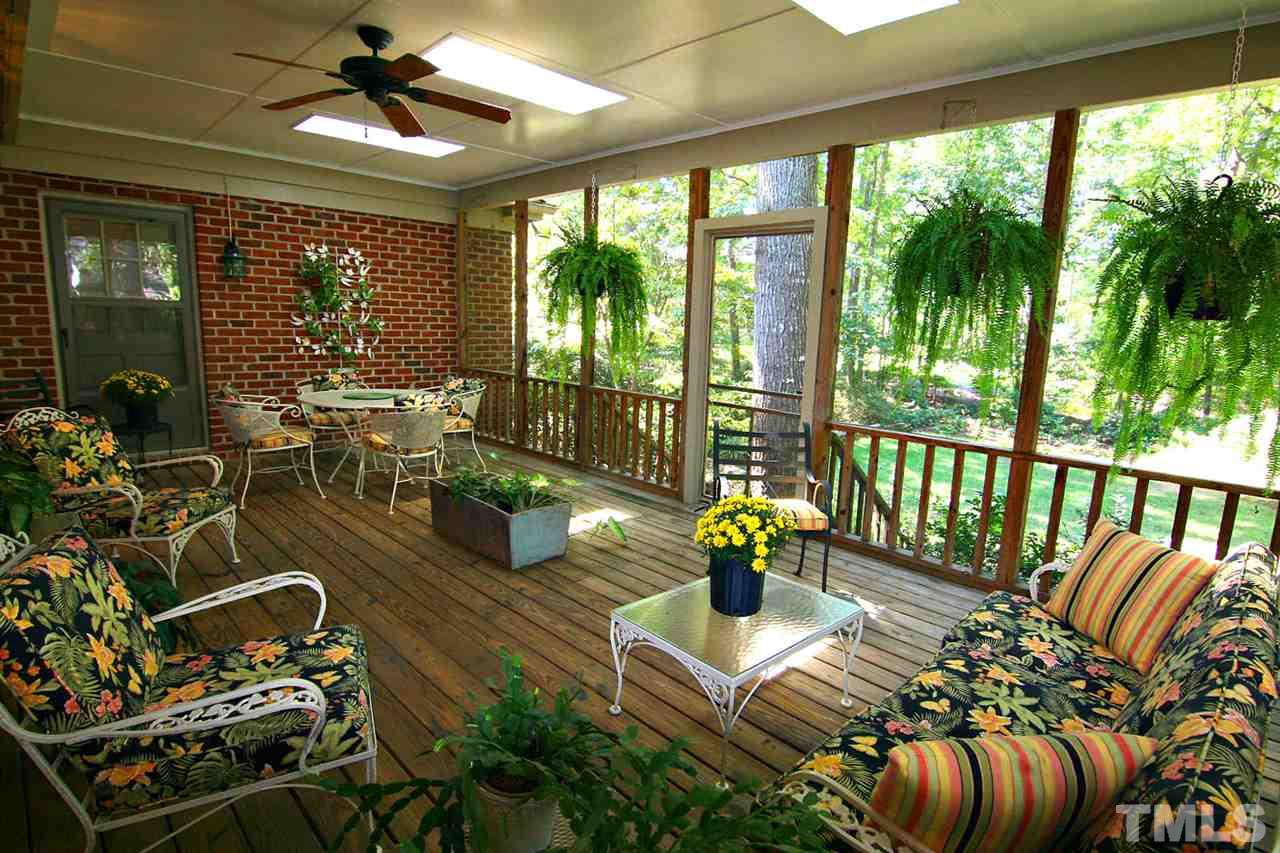 8005 Shellnut Road Raleigh, NC 27615 - Photo 3 of 25 Enjoy the View of the Tranquil Backyard from this Huge Screened Porch -- Skylights to Brighten your Day and Views to Take Your Breath Away! Imagine Your Morning Coffee or Evening Beverage on this Magnificent Screened Porch.