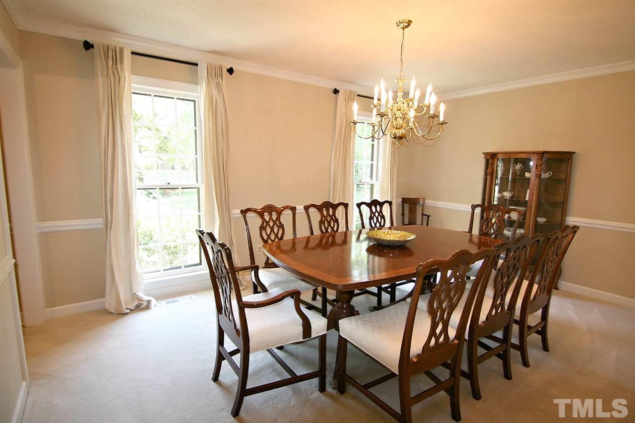 8005 Shellnut Road Raleigh, NC 27615 - Photo 7 of 25 The Oversized Dining Room is a Joy to Entertain Finest Friends or Family Members. Handsome Chair Rail, Crown Molding + New Carpet Masterfully Blends Charm and Feel of Home.