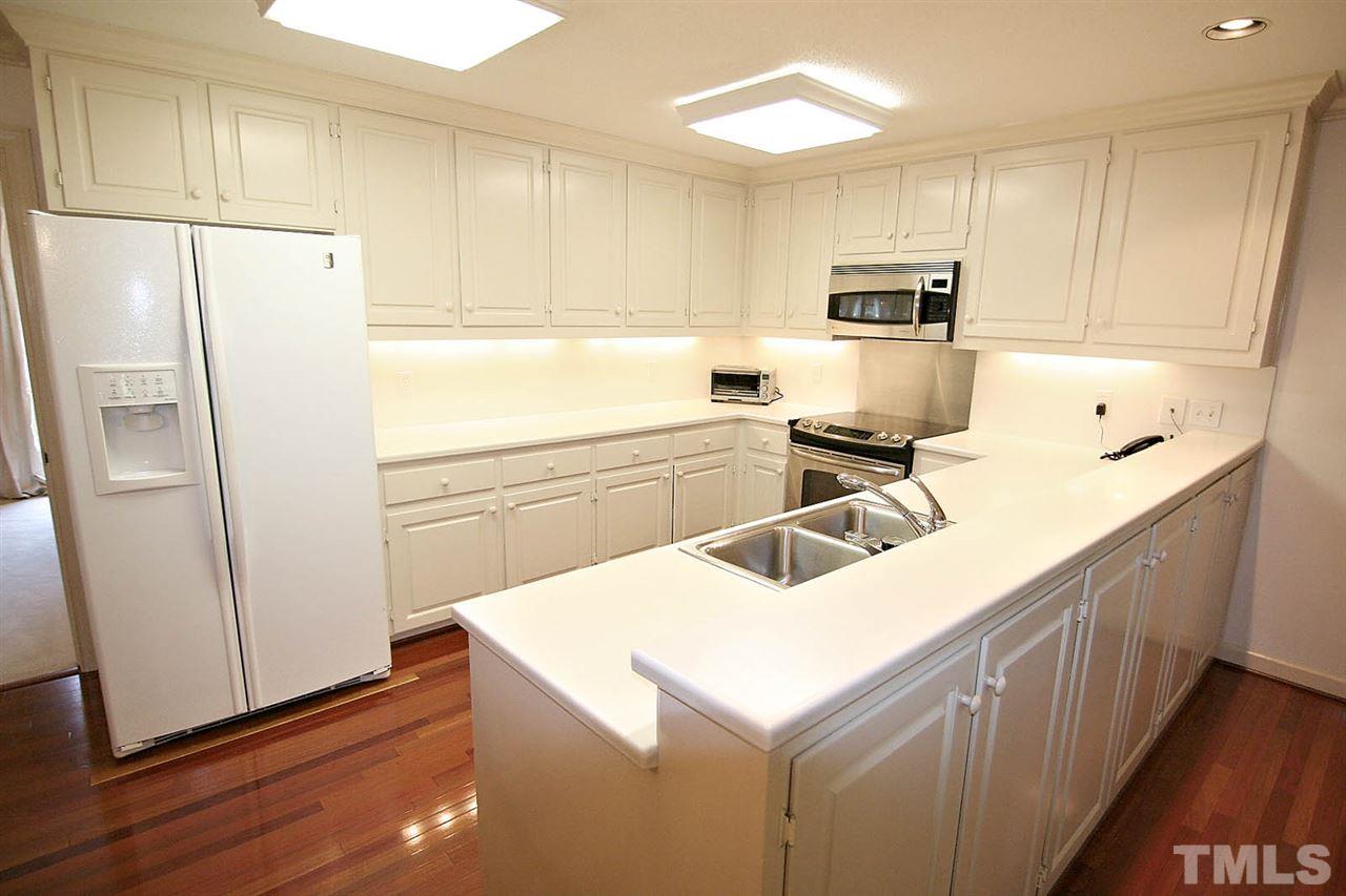 8005 Shellnut Road Raleigh, NC 27615 - Photo 9 of 25 Kitchen has Clean Lines -- Stainless Steel Appliances include a Bosch Dishwasher. There is Instant Hot Water at Kitchen Sink.