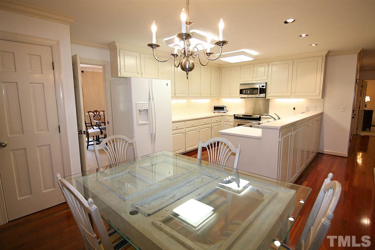 8005 Shellnut Road Raleigh, NC 27615 - Photo 10 of 25 Eat-in Kitchen is Designed to combine Food and Fun Together -- includes an Oversized Pantry and Immediate Access to Screened Porch -- It doesn't get much Better than This!!!