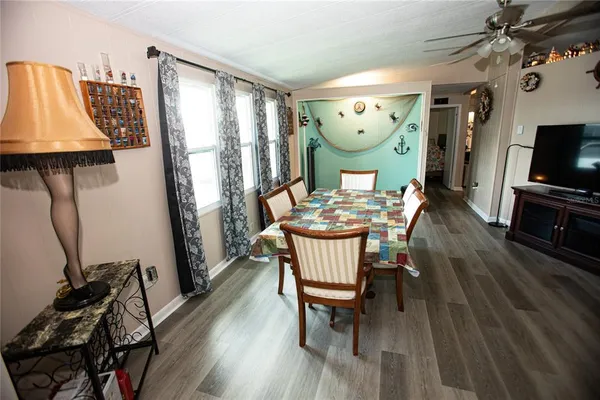 a view of a dining room with furniture window and wooden floor