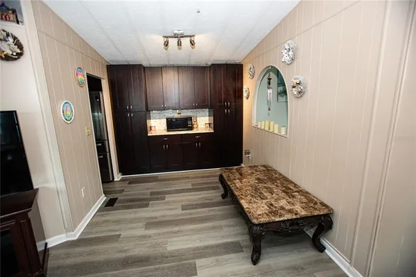 a bedroom with a bed and a mirror on the wall