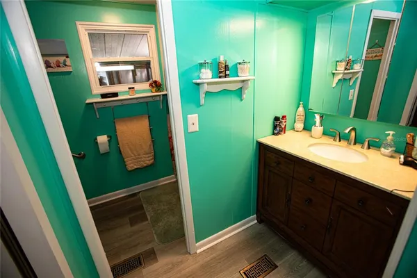 a narrow alley with a potted plant