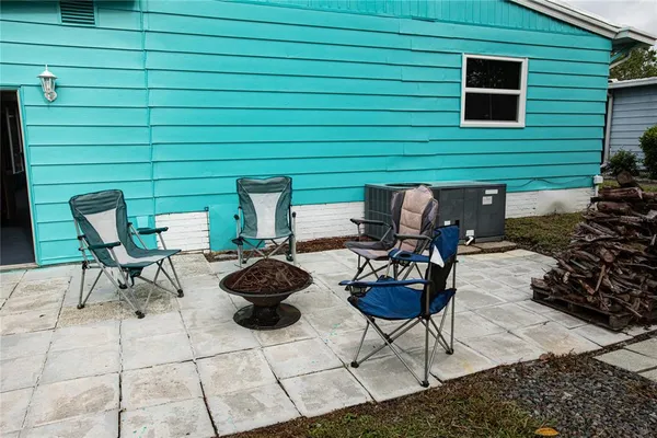 a backyard of a house with seating space