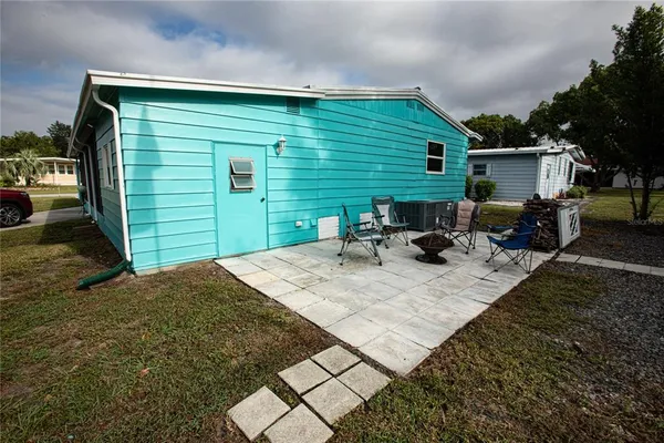 a view of a backyard with furniture