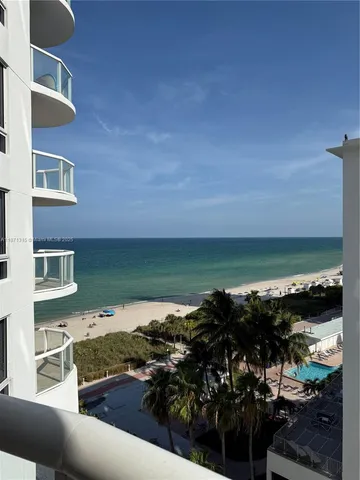a view of a lake from a balcony
