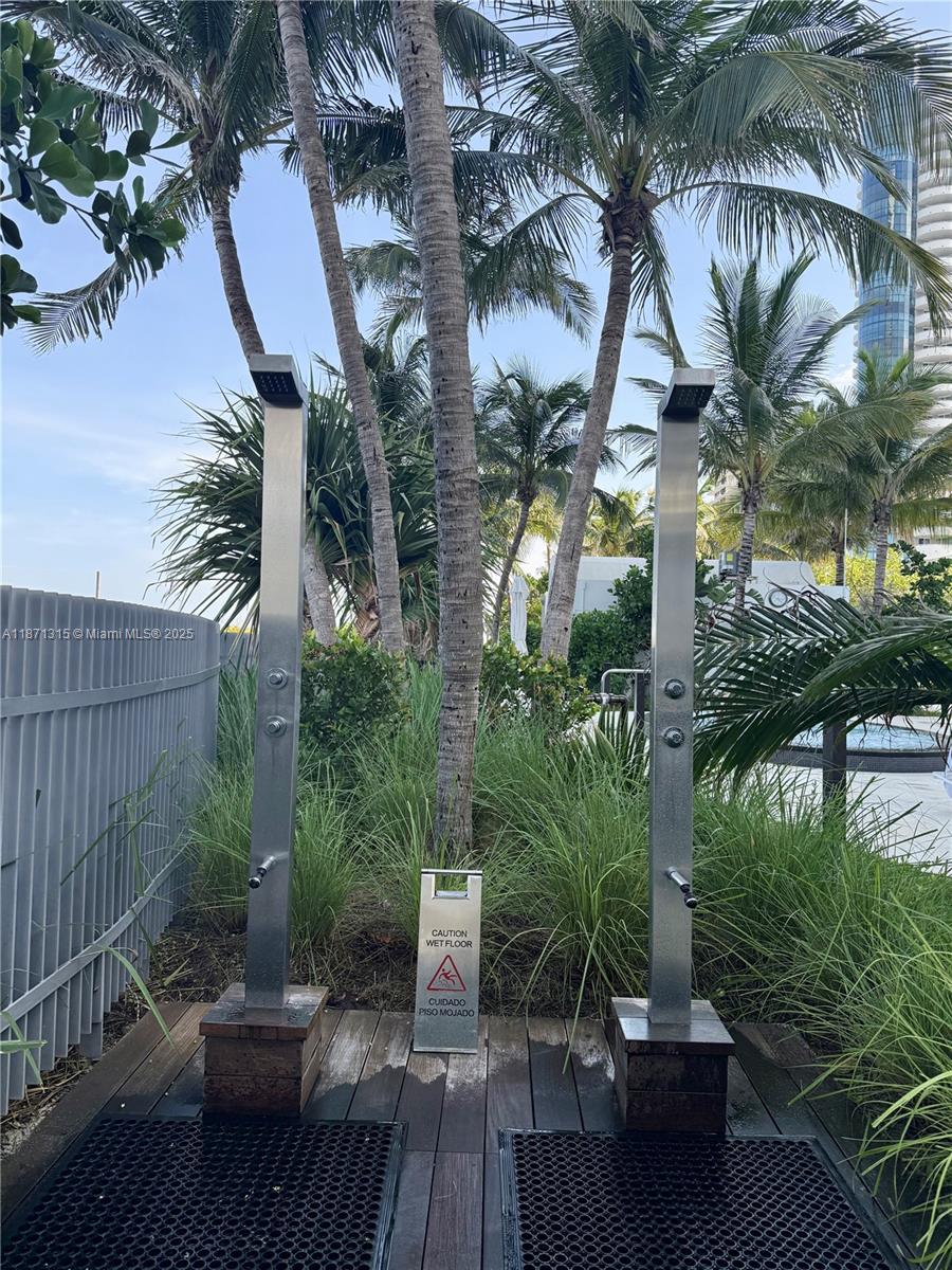 6365 Collins Avenue, Unit 904 Miami Beach, FL 33141 - Photo 34 of 35 a view of backyard with outdoor seating and plants
