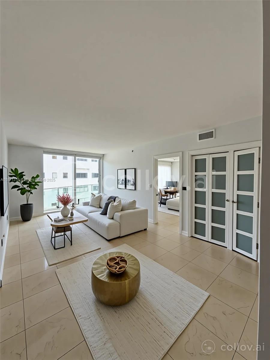 6365 Collins Avenue, Unit 904 Miami Beach, FL 33141 - Photo 35 of 35 a living room with furniture and a large window