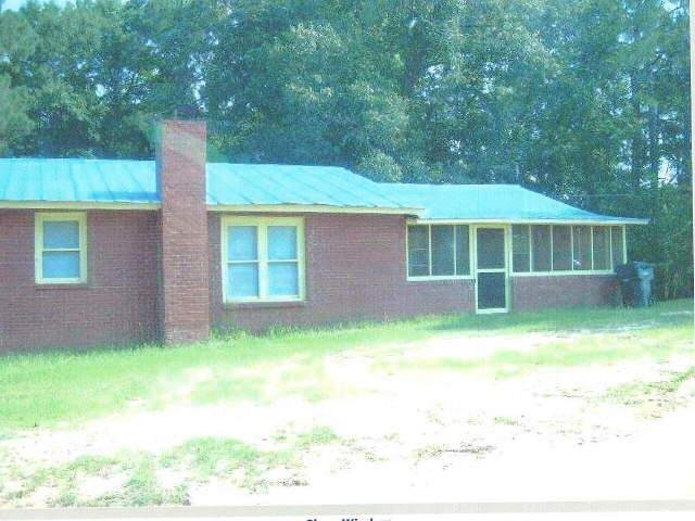 1797 Clifford Meeks Road Collins, GA 30421 - Photo 1 of 1 a house view with a backyard space